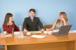 Business team sits at the table