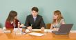 Business team sits at the table
