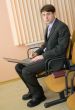 Person in a suit with the laptop