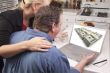 Couple In Kitchen Using Laptop - Money