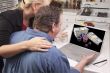 Couple In Kitchen Using Laptop - Online Poker