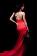lady in red with suitcase