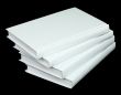 Pile from four book volumes on a black