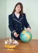 Girl in a sea uniform with globe