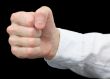 Fist it is isolated on a black background