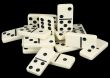 Small group from dominoes counters on a black