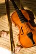 Old violin, fiddle-stick and music sheet