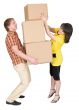 Girl loads the man with cardboard boxes