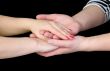 Man`s and female hands on a black