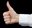 Man`s hand showing gesture on a black