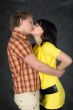 Couple kiss on a black background