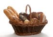 basket assortment of baked bread isolated on white