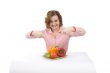 Beautiful young woman with fresh vegetables.