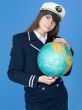 Woman in sea uniform and globe