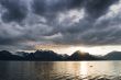 sunset at lake with dark clouds