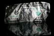 Crumpled dollar isolated on black