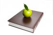 Books and green apple