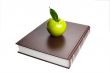 Books and green apple