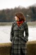 young woman near river standing