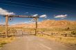 A gate and a fence in desert, wild west