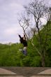 young girl jumping in park