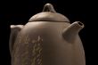 teapot on black background