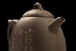 teapot on black background