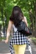 Young Asian woman walking, photo from the rear.