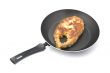 fried fish steak on griddle close up