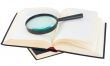 Books and magnifying glass