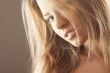 Beautiful blond girl with hair fluttering in the wind