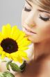 Beautiful woman with a sunflower