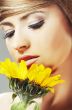 Beautiful woman with a sunflower