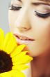 Beautiful woman with a sunflower