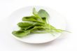 Spinach leaf on the white plate