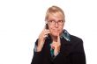 Intrigued Blonde Woman Using Phone