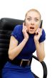 Busy and shocked businesswoman with two phones