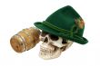 Alpine hat on skull next to an oak barrel