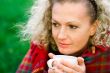 woman holding a cup