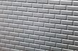 Wall of metallic bricks