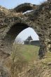 Two towers of ancient castle through arch