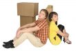 Guy and the girl sit near boxes