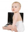 Baby sitting on a white background with laptop