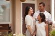 Small Hispanic Family in Front of Their Home