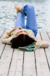 woman lying near the river