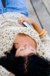 woman lying with book