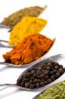 metal spoons with spices