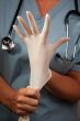 Abstract of Doctor Putting on Latex Gloves