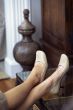 Woman Resting Feet at bedroom