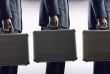 Rat Race . Businesspeople with luggage